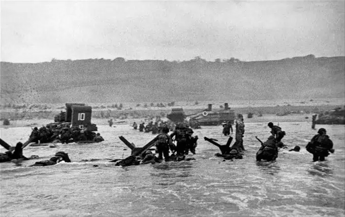 Museum of the American G.I in College Station, Texas - Image of Soldiers wading ashore between obstacles on Omaha Beach D-Day