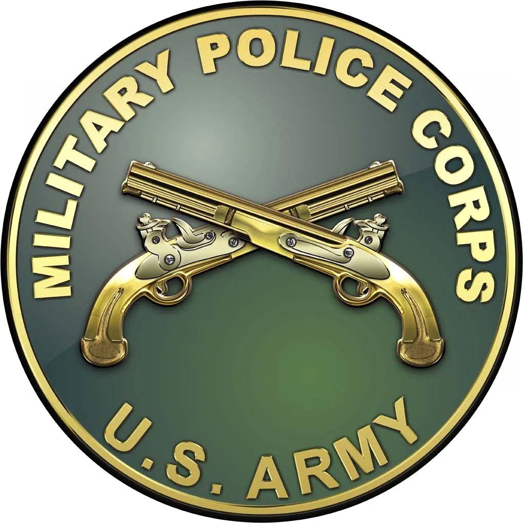 Museum of the American G.I in College Station, Texas - Image of US Army Military Police plaque with branch insignia, letters, and rim in gold in a green background