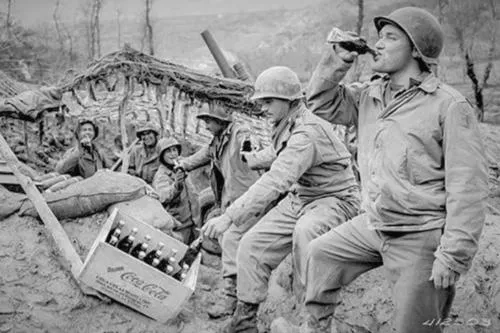 Museum of the American G.I in College Station, Texas - Image of World War II & Interwar Period, Where Men of the 133rd Field Artillery Battalion enjoy Cokes on the front, March 17, 1944.